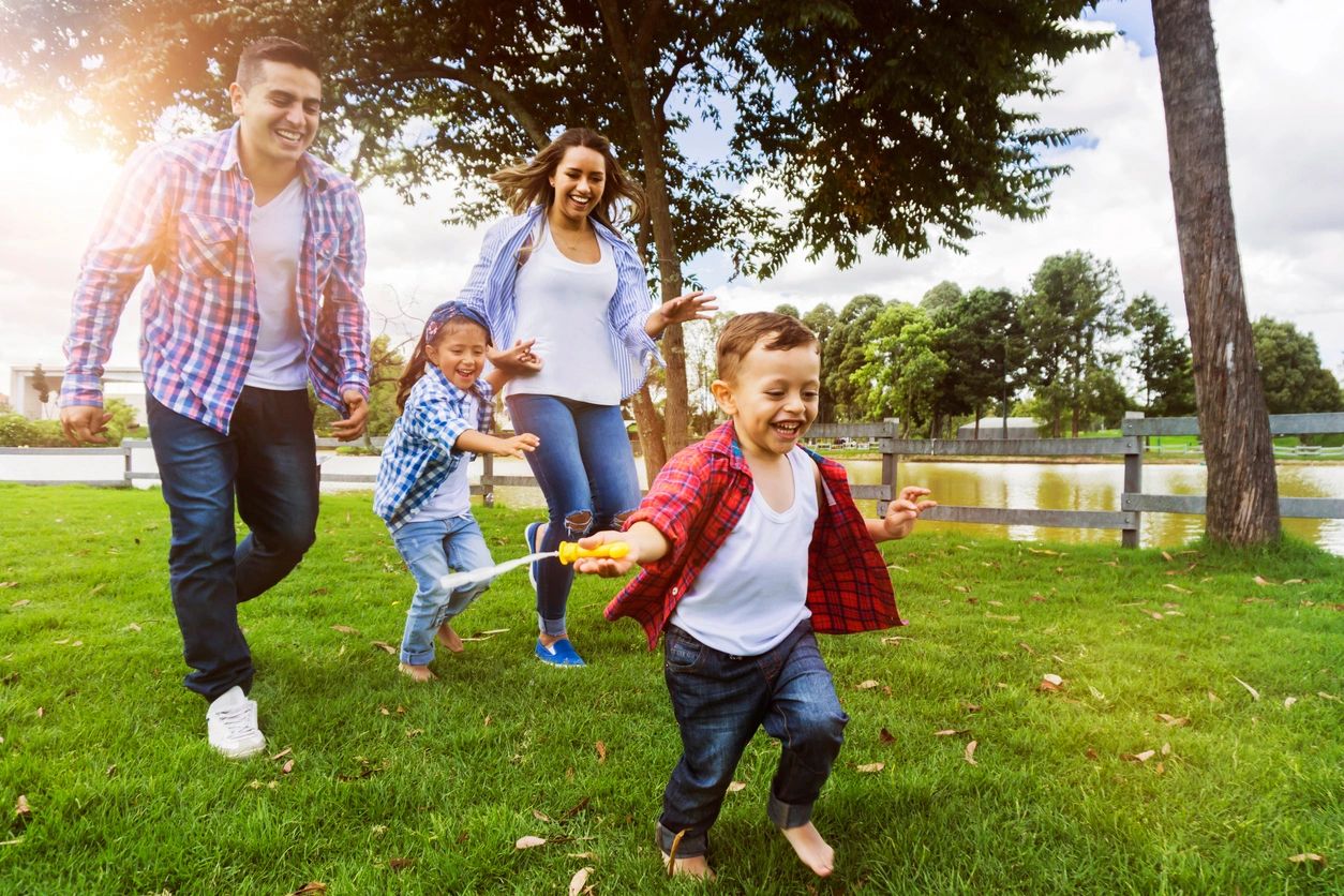 family playing in the park